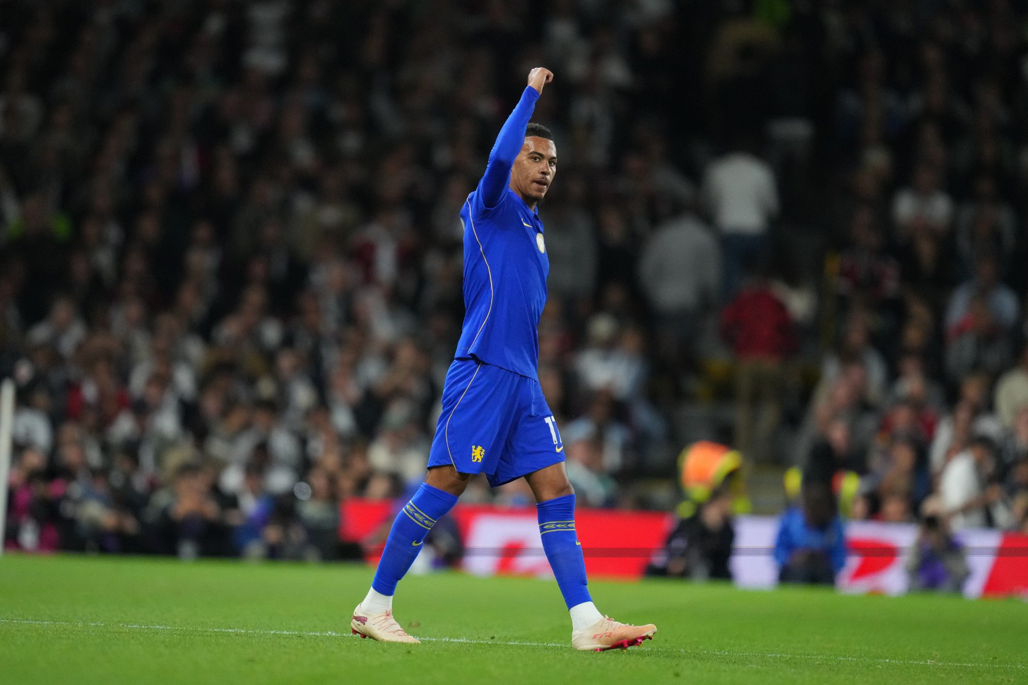 Morgan Rogers celebrates in a Chelsea shirt during a football match