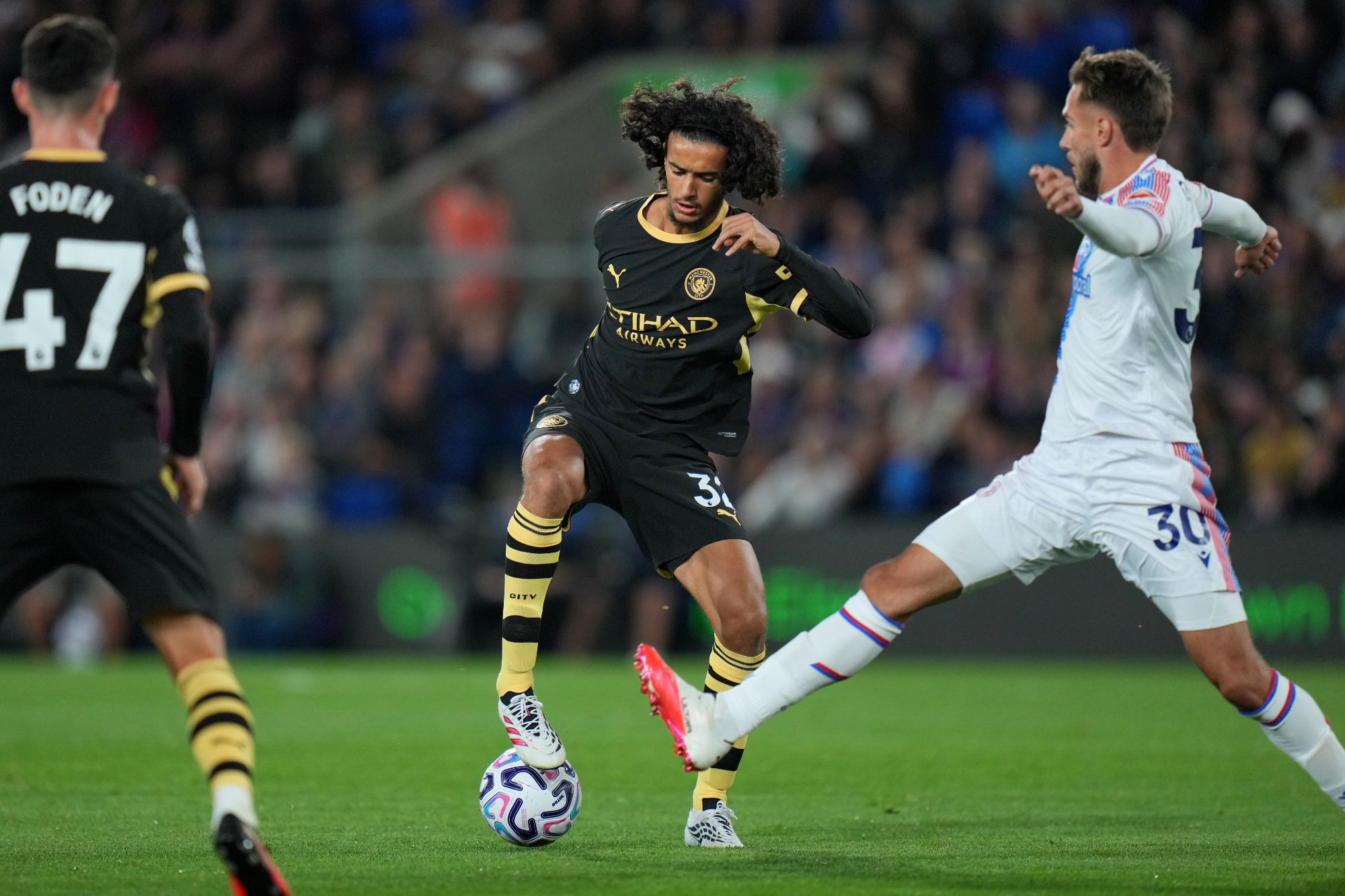 Manchester City midfielder Ayyoub Bouaddi dribbling the ball during a match against his former club Lille.